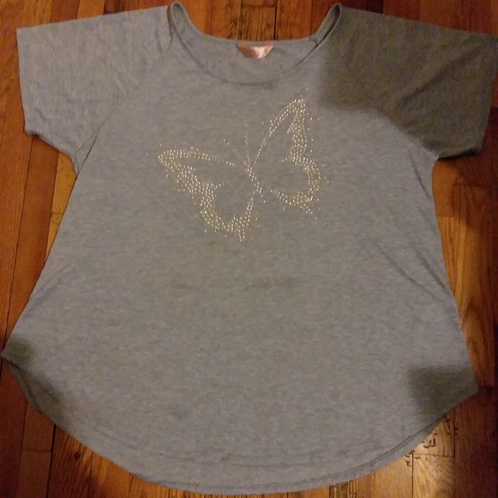 Super soft tee with butterfly embellishment.